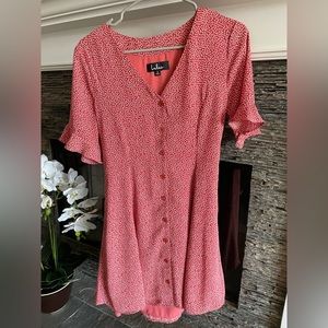 Cute floral mini dress with buttons down front, flared sleeves, bow in back